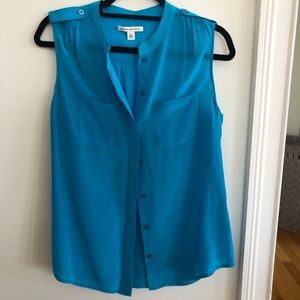Bright blue sleeveless blouse